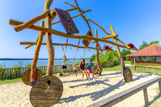 Playground with swing at CAPFUN Paillotte campsite in AZUR (40).