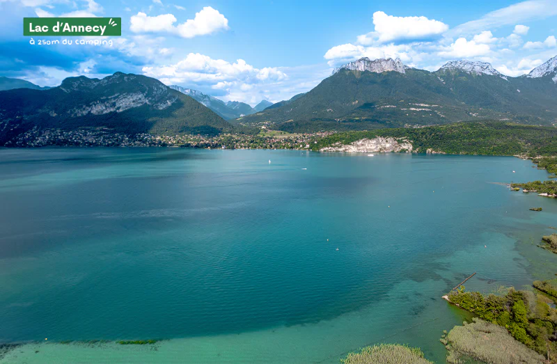 Lake Annecy with turquoise waters, surrounded by green mountains in Haute-Savoie.