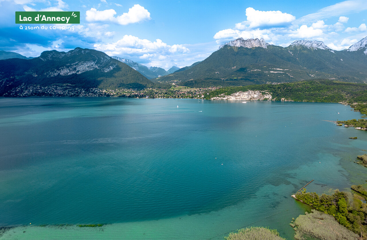 Lake Annecy with turquoise waters, surrounded by green mountains in Haute-Savoie.