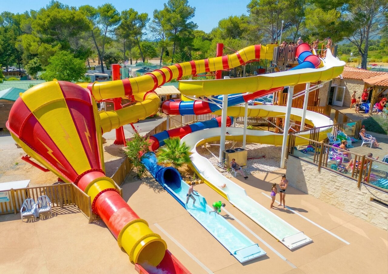 Colorful water slides and water games at CAPFUN Arbois du Castellet campsite in LE CASTELLET (83).