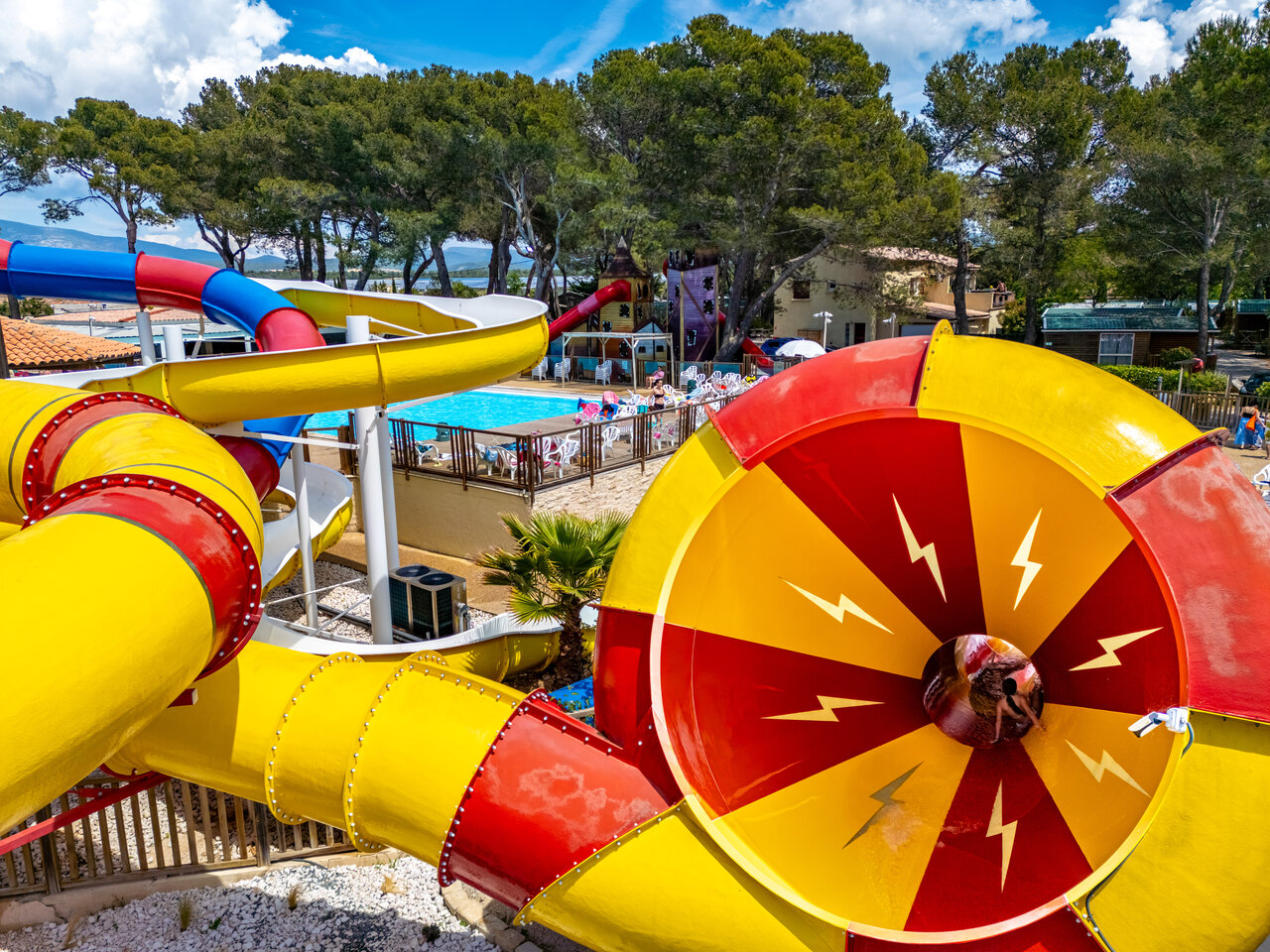 Colorful water slides and outdoor pool at CAPFUN Arbois du Castellet, LE CASTELLET.