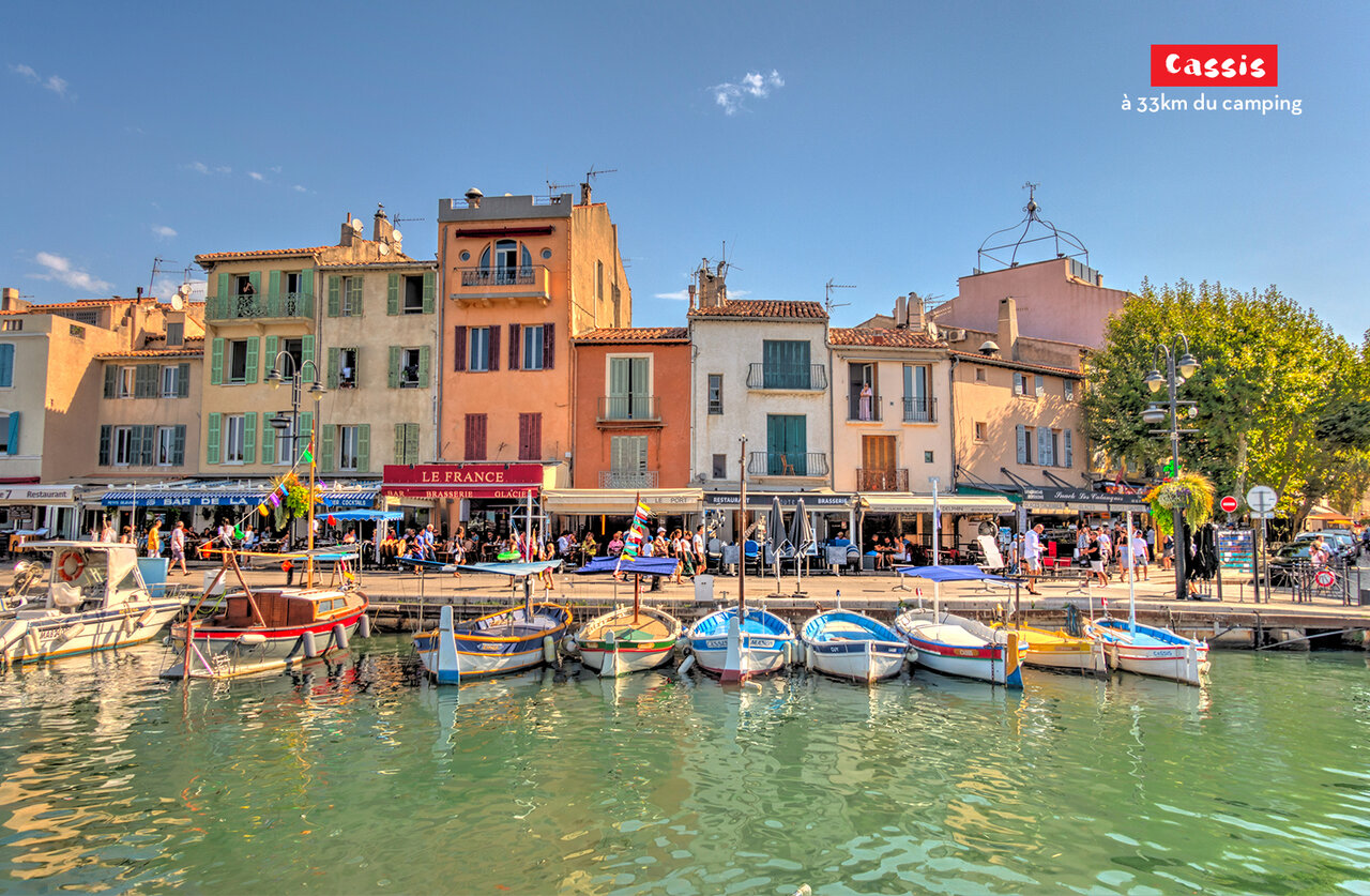 Port of Cassis with colorful houses and fishing boats in Provence.