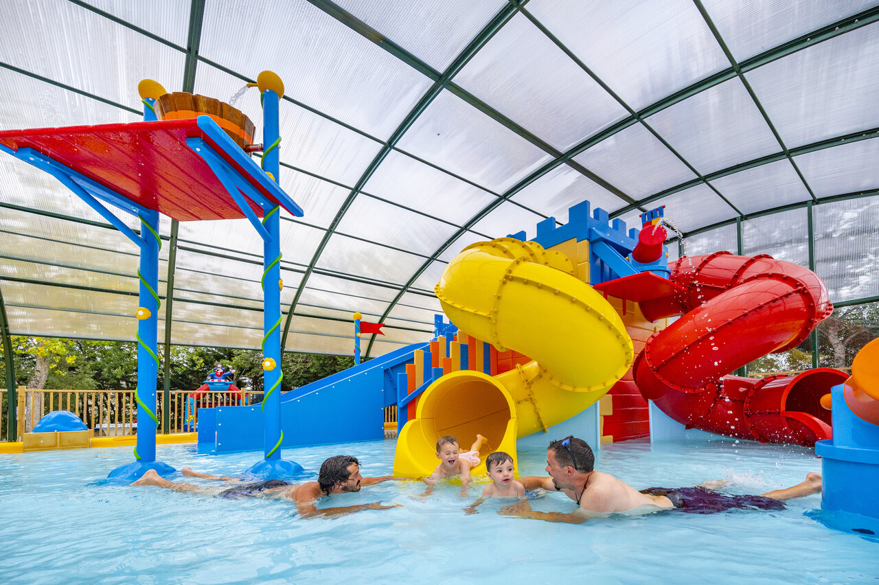 Indoor pool, slides and water games at CAPFUN Armor H�ol Piriac.