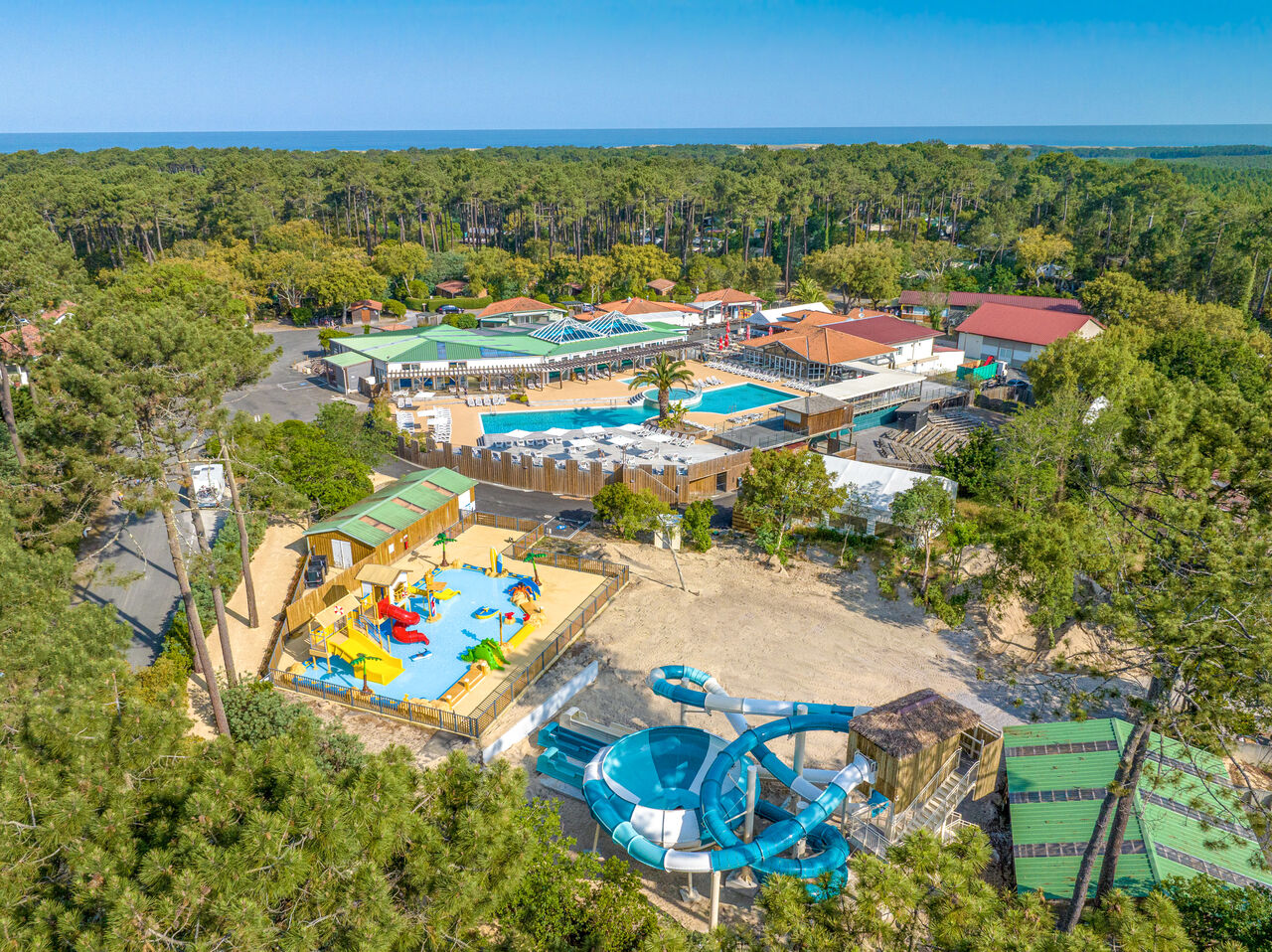 Water park, swimming pools, slides at LIBRANOO Naturiste Arnaoutchot campsite in Veille-Saint-Girons, Landes, France.