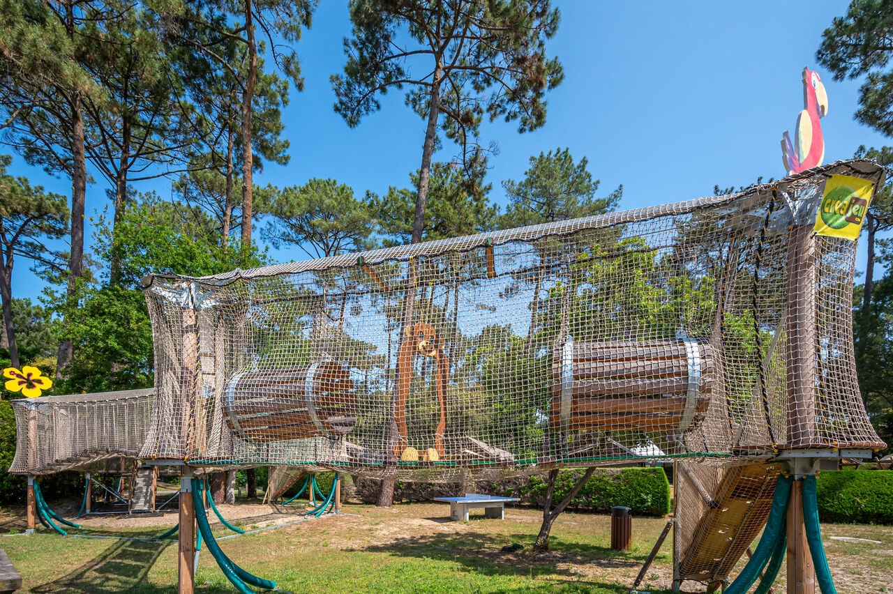 Large playground with net and wood at LIBRANOO Naturiste Arnaoutchot campsite, Veille-Saint-Girons, Landes.