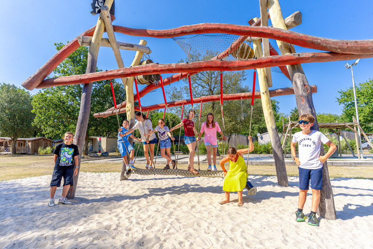 Wooden playground for children at CAPFUN Atlantique Parc campsite, Les Mathes.