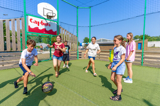 Multisport field with young people playing football at CAPFUN Atlantique Parc.