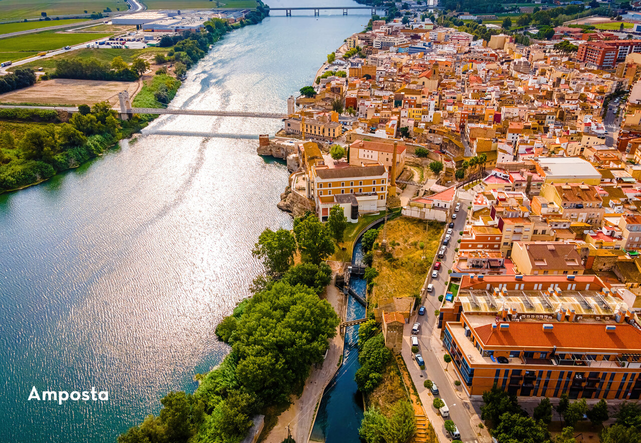 Aerial view of Amposta, coastal city with bridge over Ebro River, Tarragona.