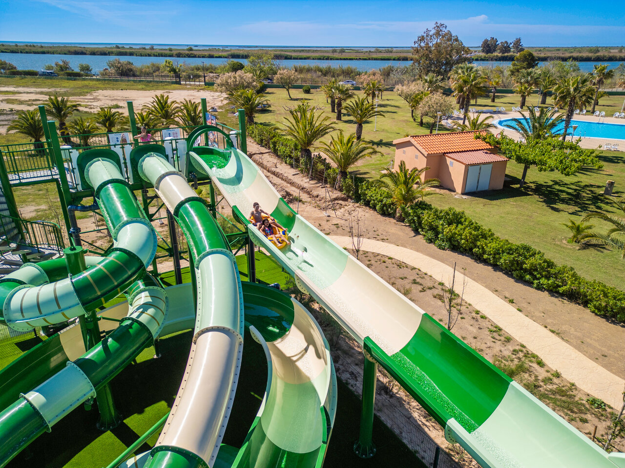 Giant water slides and outdoor swimming pool at CAPFUN Aube campsite in Deltebre, Tarragona.