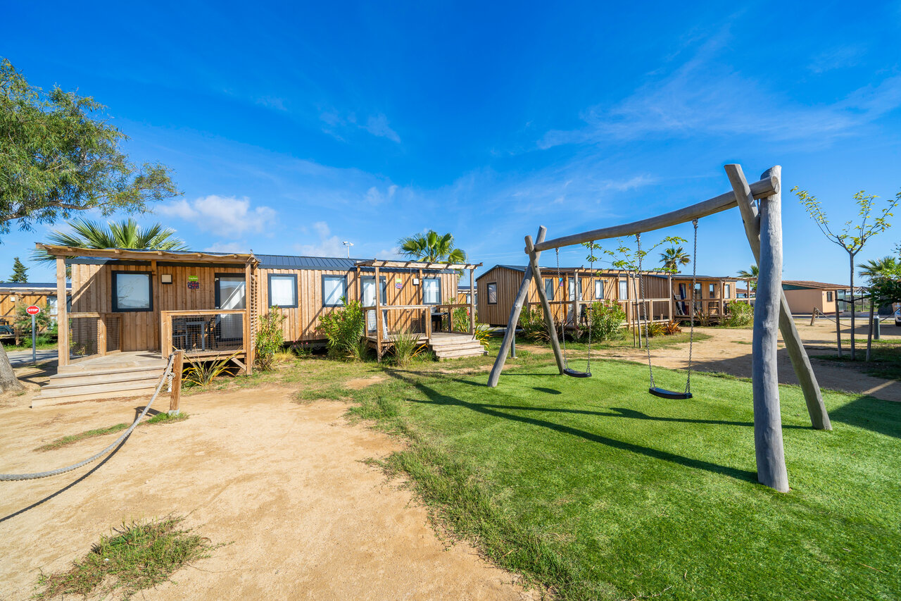 Swing set, wooden mobile homes at CAPFUN Aube, Deltebre, Tarragona (43).