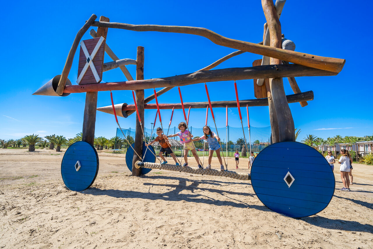 Children on large wooden play structure at CAPFUN Aube campsite, Deltebre.