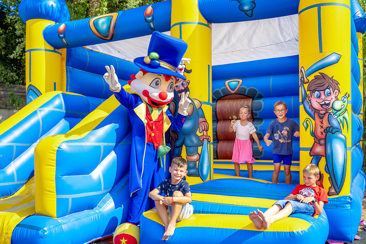 Children and mascot on bouncy castle at CAPFUN Aubr�des campsite in Puget sur Argens (83).