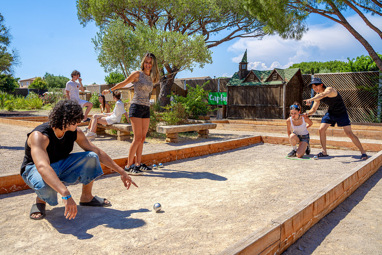 Young people playing p�tanque at CAPFUN Aubr�des campsite, Puget sur Argens.