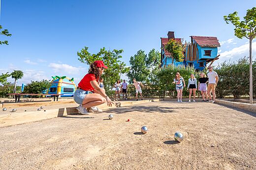 Petanque court with players at CAPFUN Barbacane campsite, NARBONNE (11).