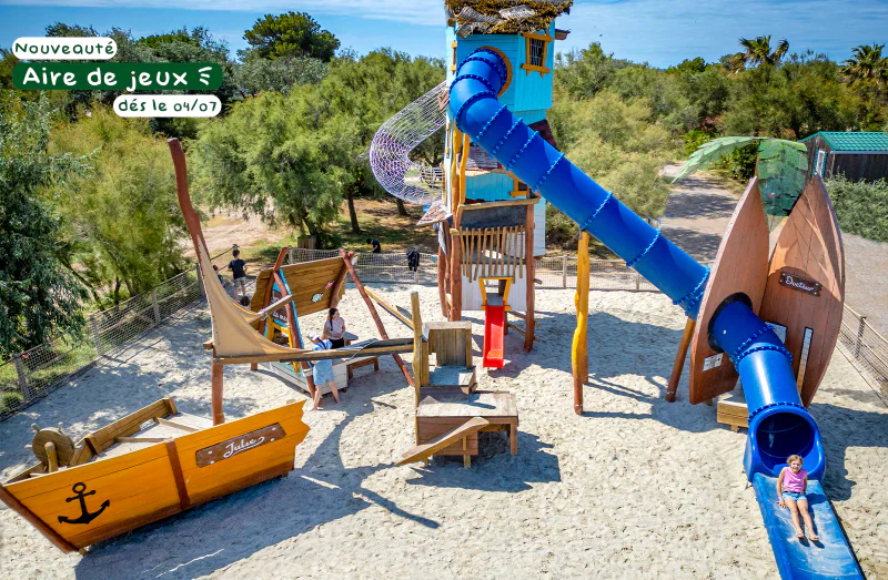 Playground, slides, wooden structures at CLICOCHIC Bastets campsite in Marsanne.