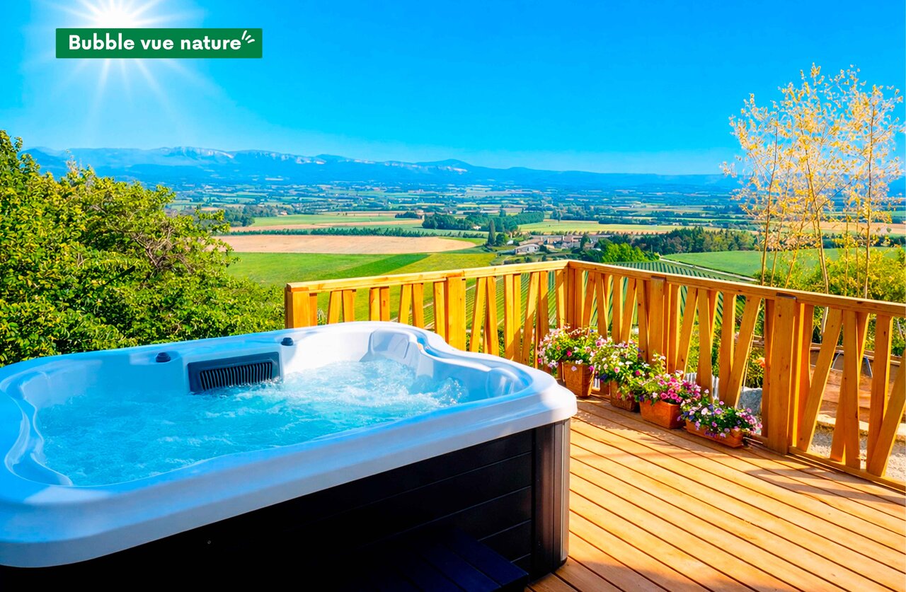 Outdoor hot tub on wooden deck, nature view at CLICOCHIC Bastets campsite in Marsanne (26).