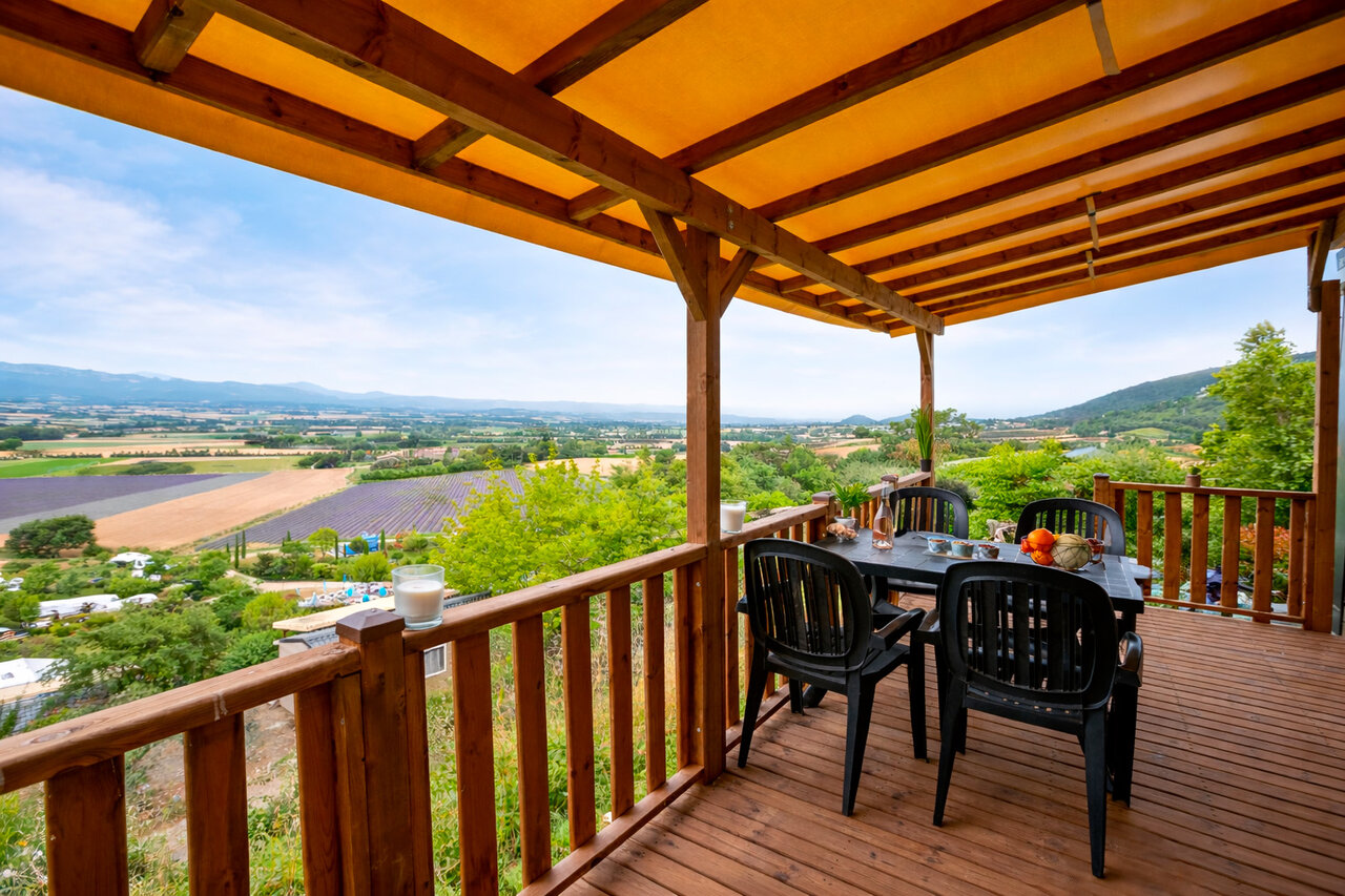 Accommodation terrace, panoramic view lavender fields. At CLICOCHIC Bastets campsite in Marsanne (26).