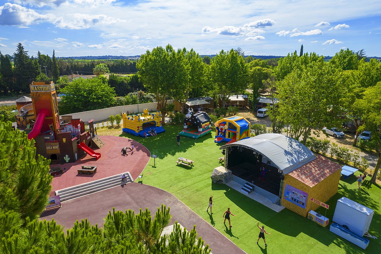 Large playground, inflatable structures and animation stage at CAPFUN Bastide campsite in N�mes (30).
