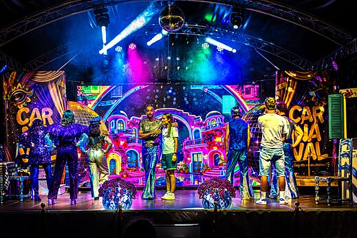 Colorful carnival show with performers on stage at CAPFUN Bastide campsite in N�mes (30).