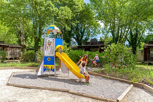 Children's playground with slide at CAPFUN Bastide campsite in N�mes (30).