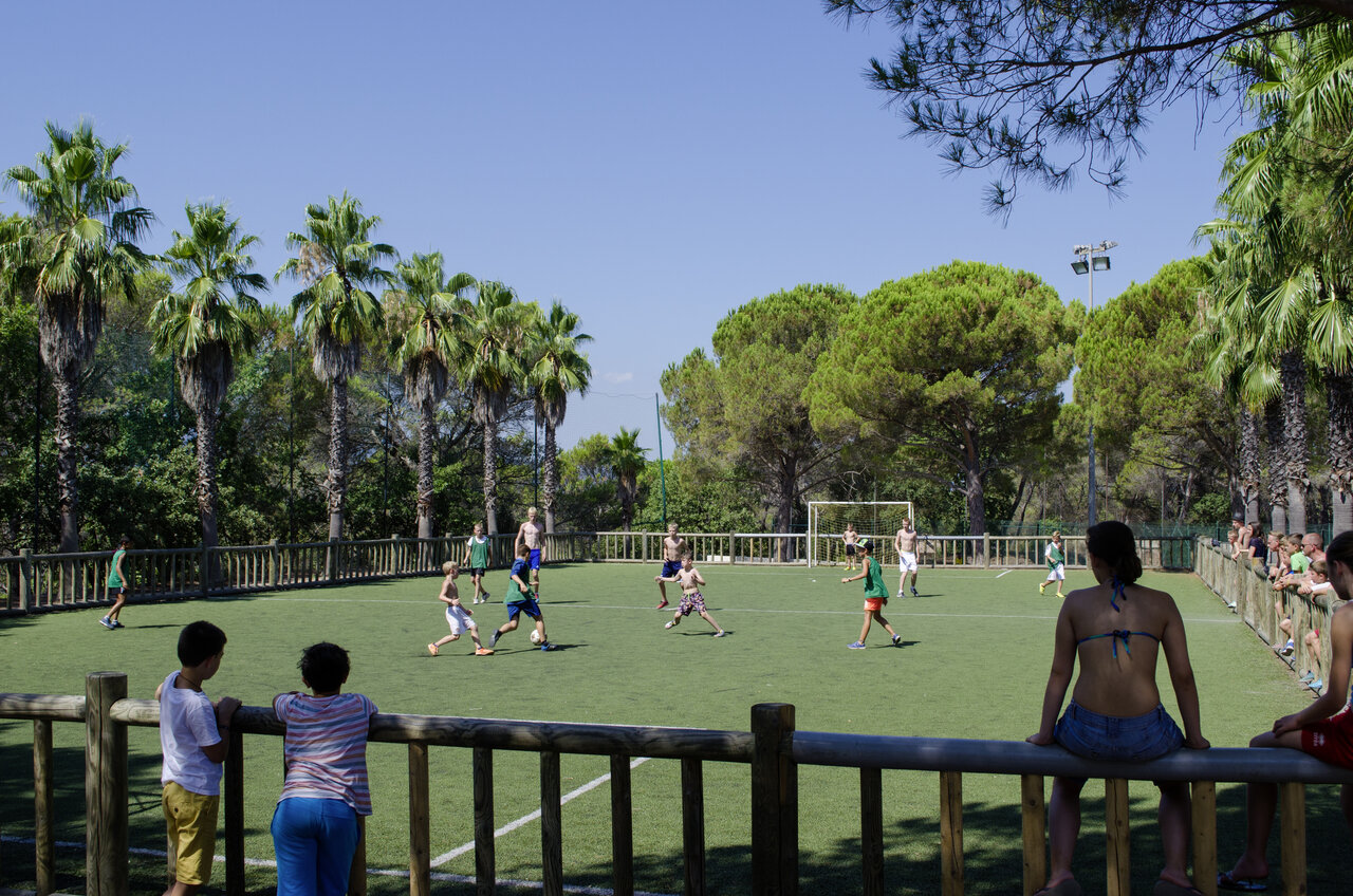Children playing football on pitch at camping CAPFUN La Baume in Fr�jus.