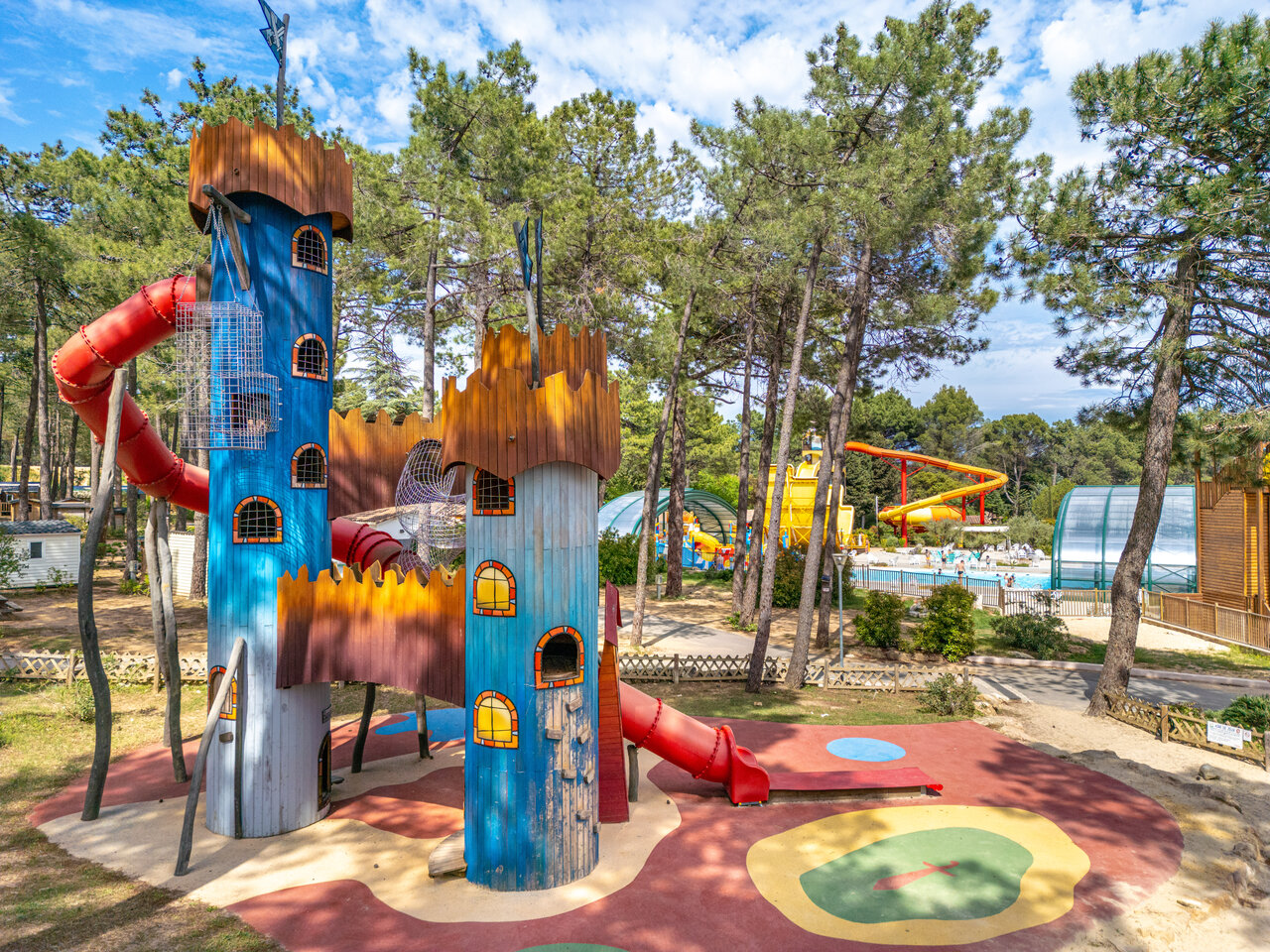 Castle playground, slides and swimming pool at CAPFUN Beauregard, MORNAS (84).