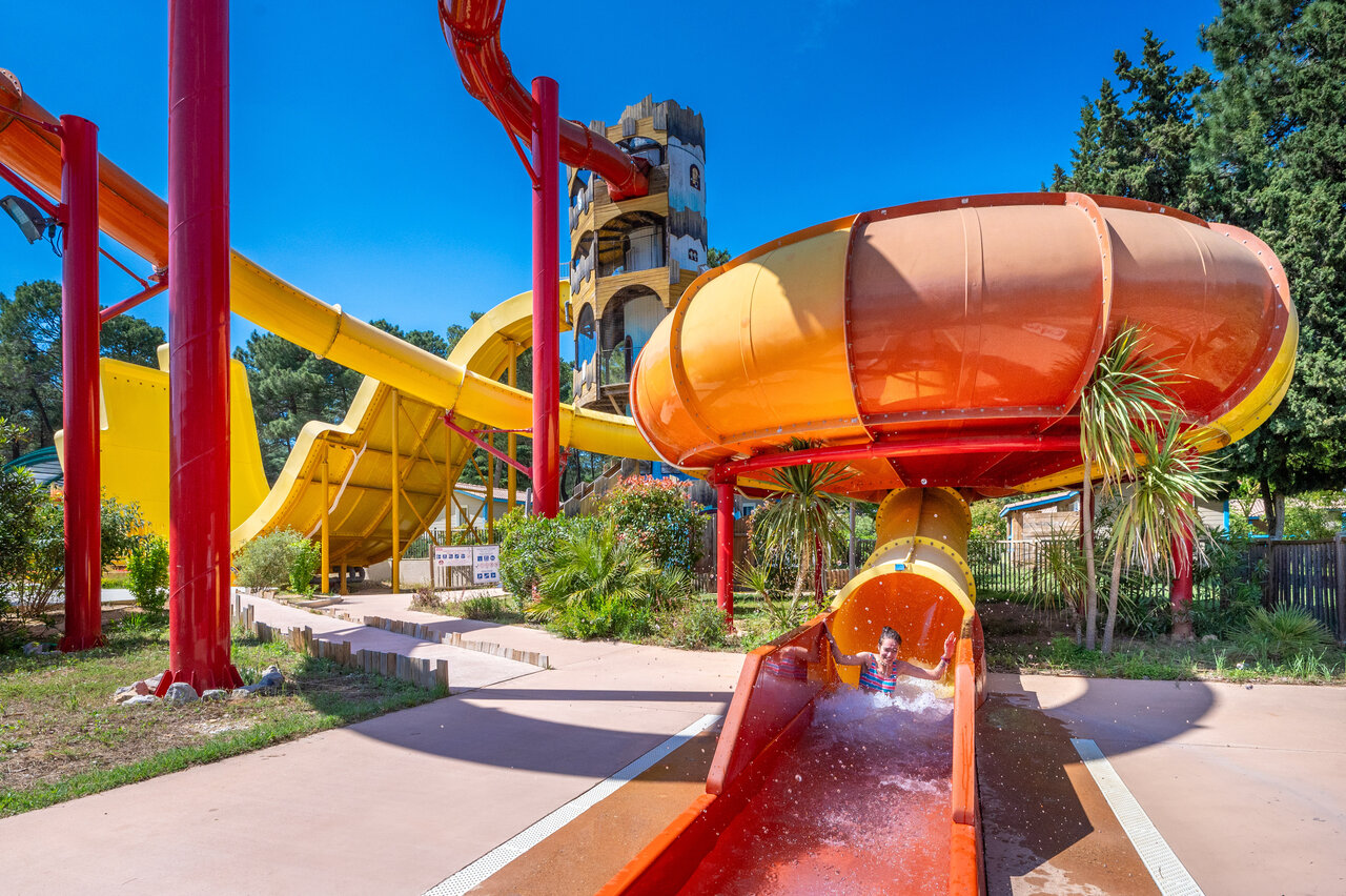 Child on giant water slide, CAPFUN Beauregard campsite, MORNAS (84).