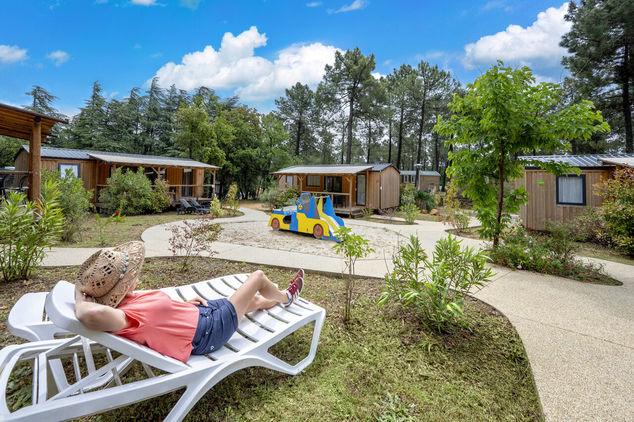 Mobile homes, playground, sun lounger at CAPFUN Beauregard campsite in MORNAS (84).