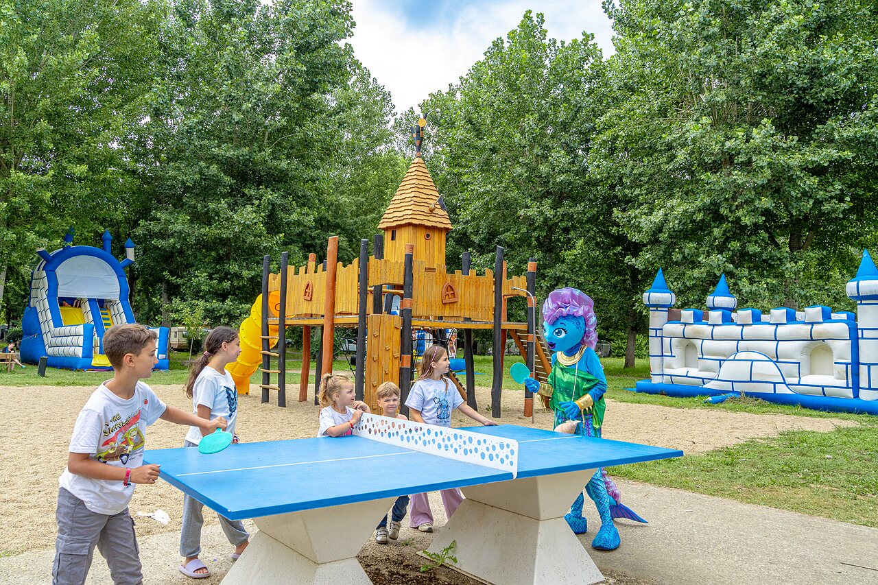 Playground, children, mascot, table tennis at CLICOCHIC Beau Rivage campsite in LA ROQUE-GAGEAC.