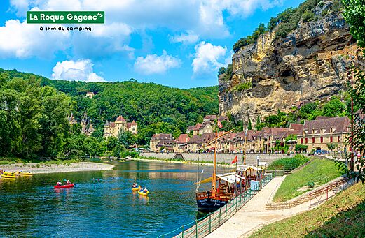 Village of La Roque-Gageac, troglodyte houses and gabares on the Dordogne river.