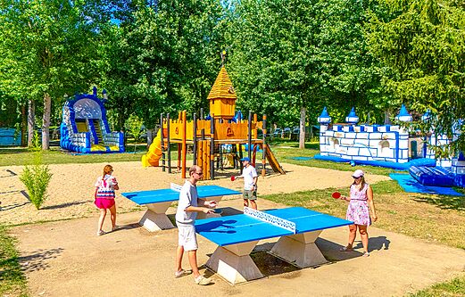 Playground, inflatable structures, table tennis at CLICOCHIC Beau Rivage campsite.