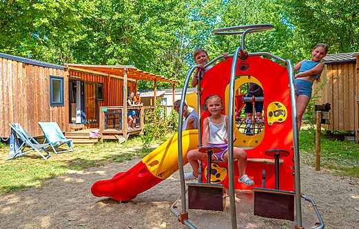 Playground, Mobile home at CLICOCHIC Beau Rivage campsite in LA ROQUE-GAGEAC.