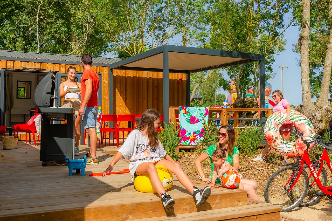 Family enjoying mobile home terrace, barbecue, float, CAPFUN Bel Air campsite (85).