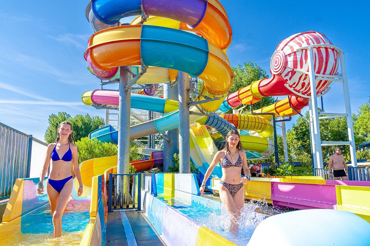 Colorful water slides, girls at CAPFUN Bel Air campsite in Aiguillon sur Mer (85).