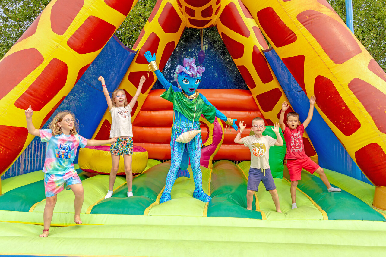 Kids, mascot, bouncy castle at VAGUES OCEANES Bois Joly campsite, Saint-Jean-de-Monts.