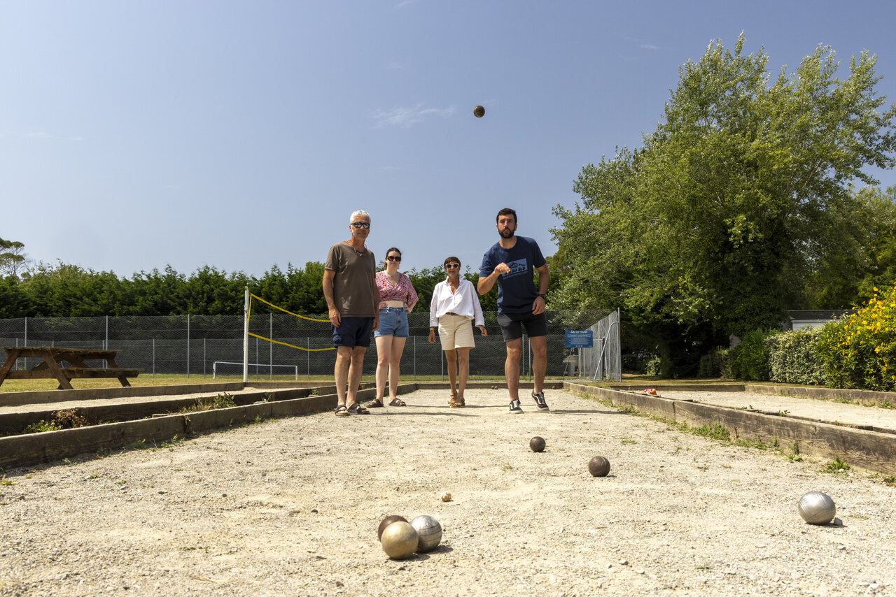 Petanque game on the court at CLICOCHIC Bord�n�o campsite in Le Palais.