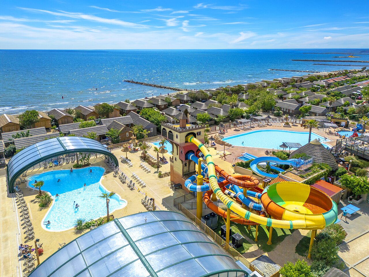 Swimming pools, slides and beach at CAPFUN Boucanet campsite in LE GRAU DU ROI (30).