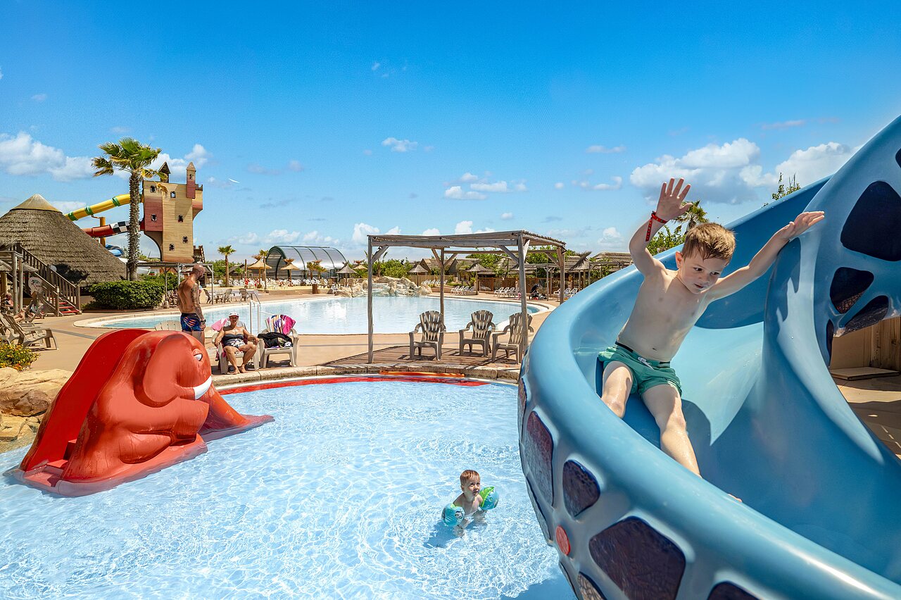 Water slide, swimming pool at CAPFUN Boucanet, LE GRAU DU ROI (30).