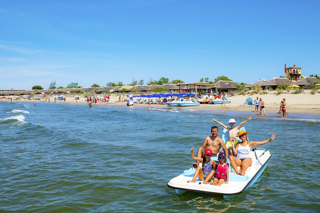 Nautical activities and lively beach at CAPFUN Boucanet campsite in LE GRAU DU ROI (30).