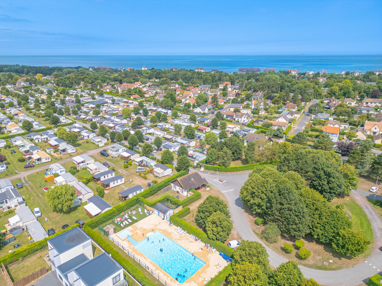 Swimming pool, mobile homes, aerial view CLICOCHIC Brise de Cabourg campsite Varaville.