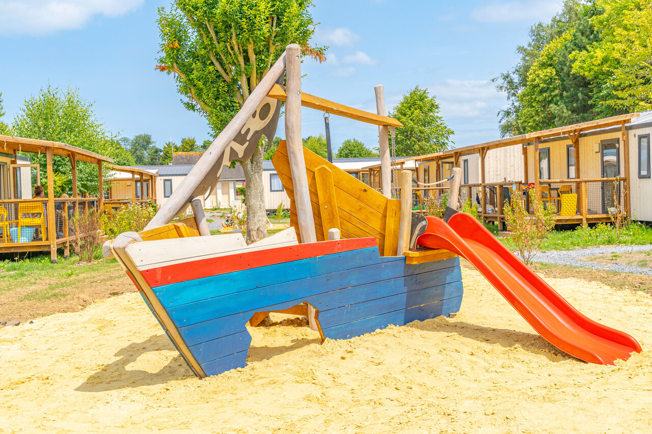 Pirate ship, red slide for children at CLICOCHIC Brise de Cabourg campsite in Varaville (14).