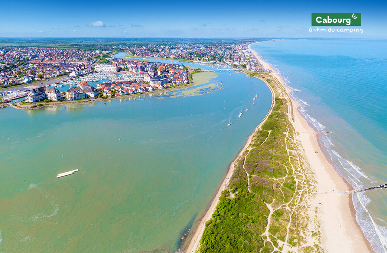 Cabourg, coastal town in Normandy, with beach, estuary and marina.