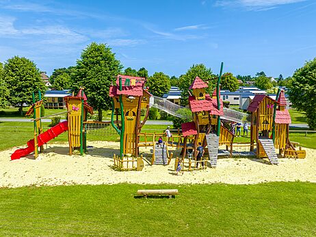 Large playground with slides at CLICOCHIC Brise de Cabourg campsite.