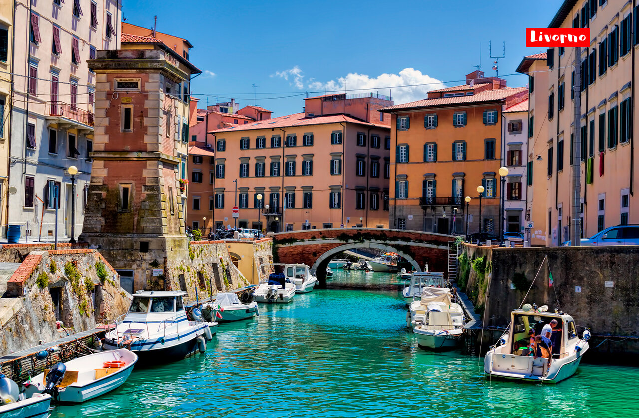 Picturesque canals and colorful buildings of Livorno, a city to visit in Tuscany.