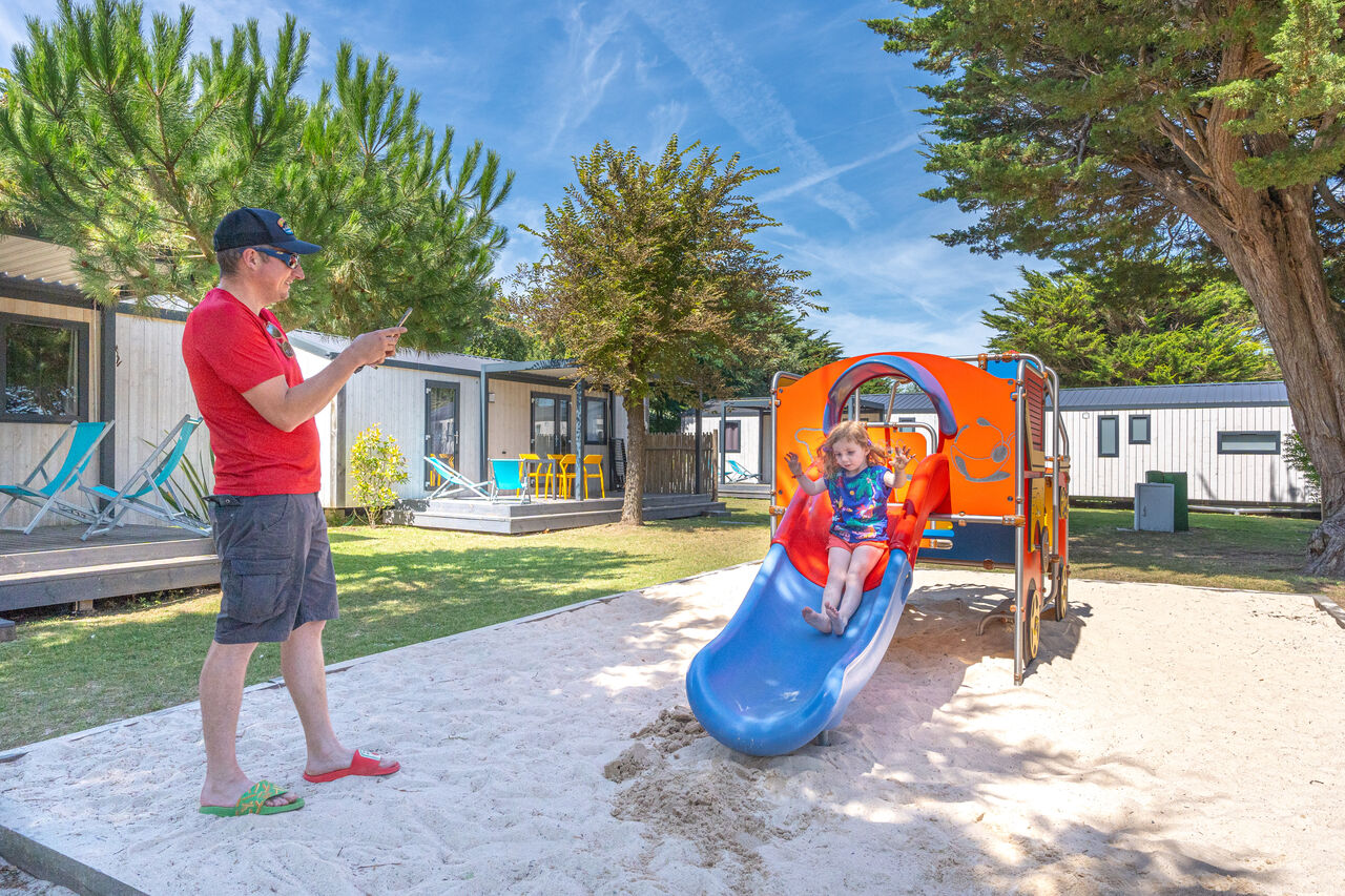 Slide, child, mobile homes at CLICOCHIC Camp du Soleil in Ars-en-R�.