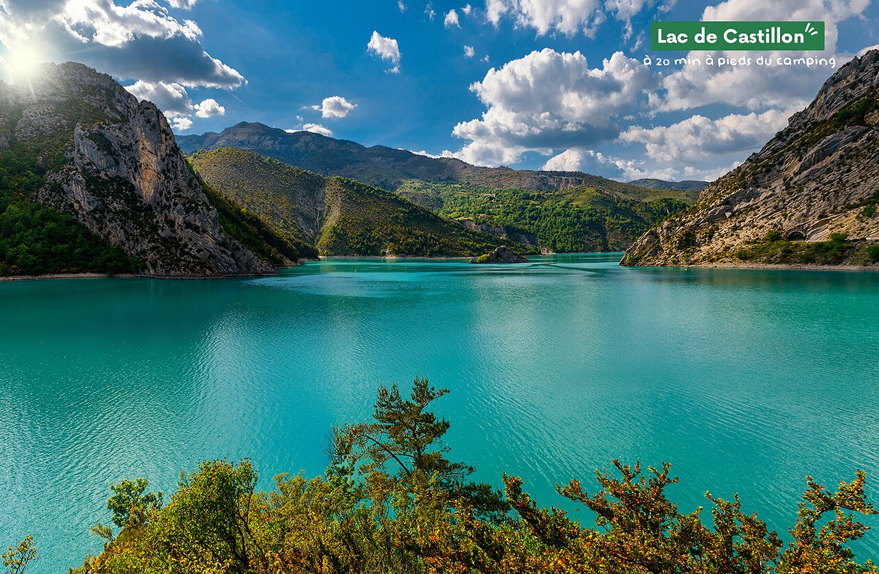 Lake of Castillon with turquoise waters, surrounded by green mountains, near Castellane.