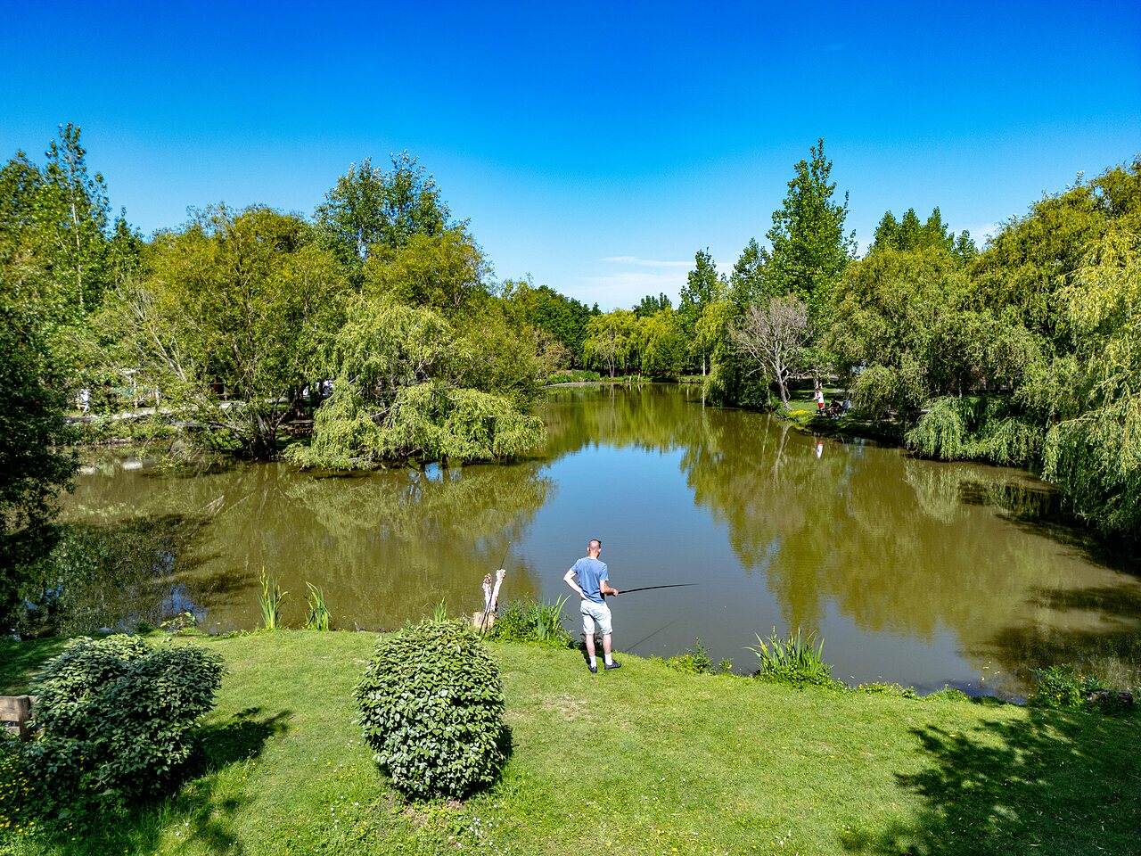 Fishing in the green pond at CAPFUN Cenic campsite in PENESTIN (56).