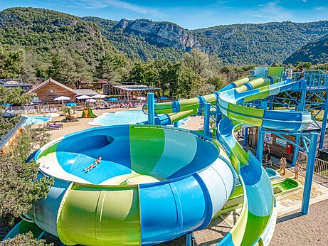 Water slides and outdoor pools at CLICOCHIC Chancia campsite in Chancia (01).