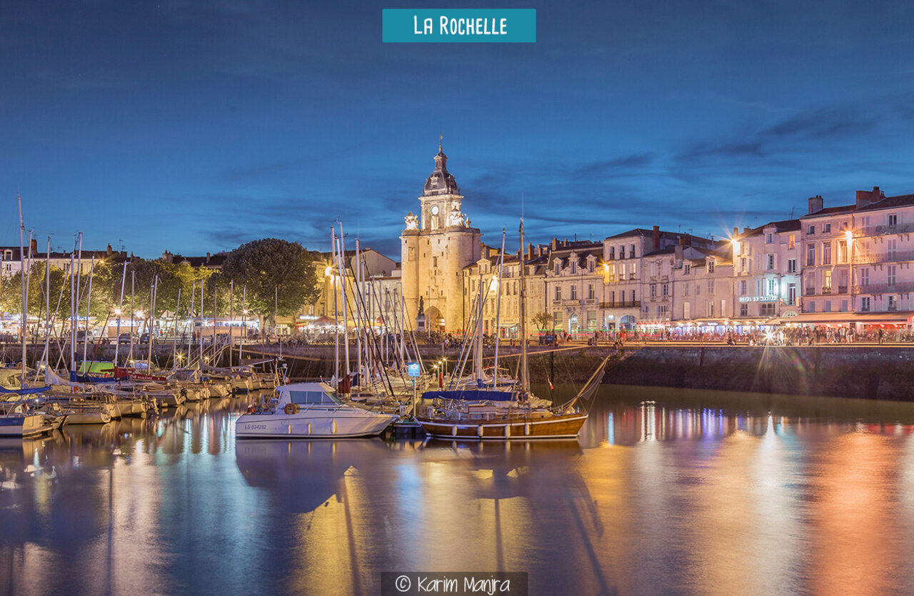 Old Port of La Rochelle illuminated at night, a must-see in Charente-Maritime.