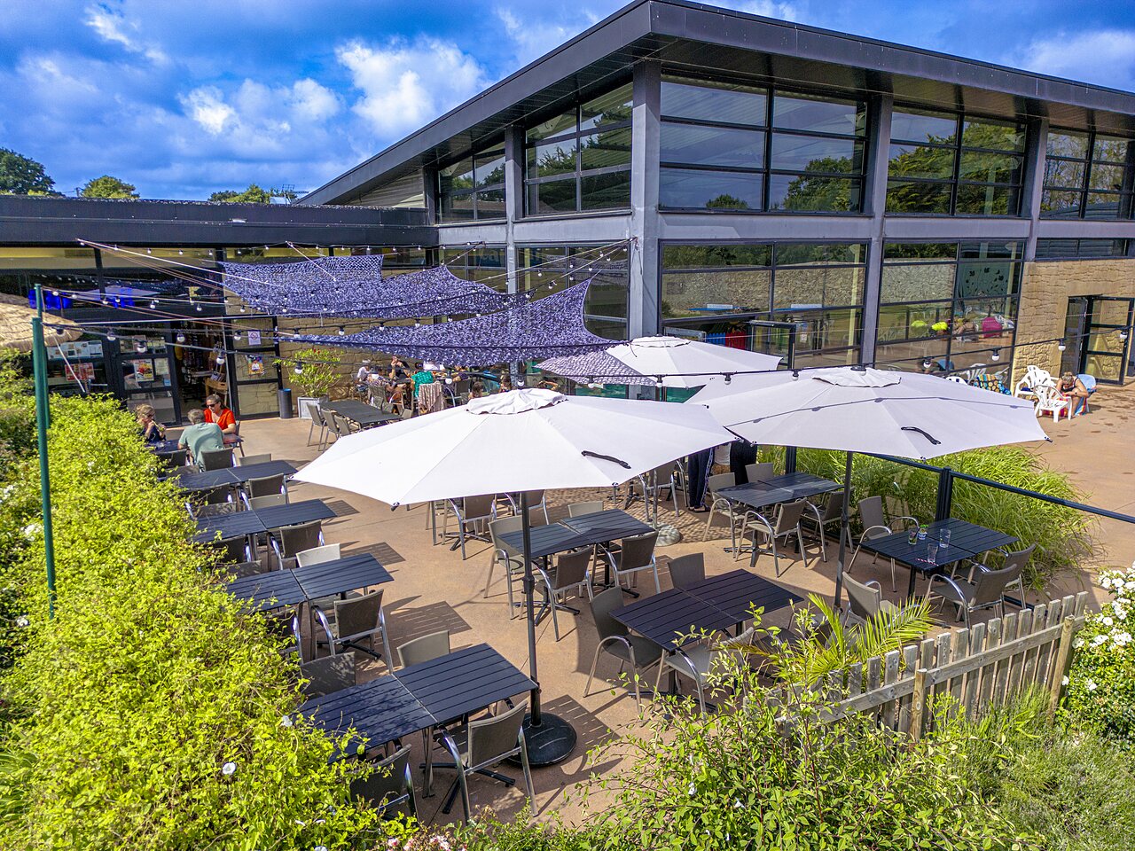 Sunny restaurant-bar terrace at CAPFUN Ch�teau de Galin�e campsite in SAINT CAST LE GUILDO.